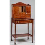 An Edwardian satinwood banded mahogany side cabinet, the superstructure with seven drawers,