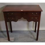 A George III style mahogany side table with three frieze drawers, 76cm wide x 77cm high.