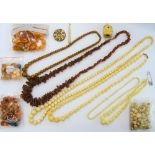 Two single row necklaces of varicoloured mottled butterscotch coloured amber beads,