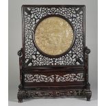 A Chinese wooden table screen with inset bowenite panel, late 19th/early 20th century,