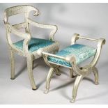 An Anglo Indian style metal veneered open armchair with rams head finials on sabre supports,