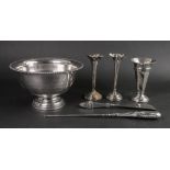 A silver trumpet shape flower vase, London 1916, with panelled sides, 13cm high, another pair,