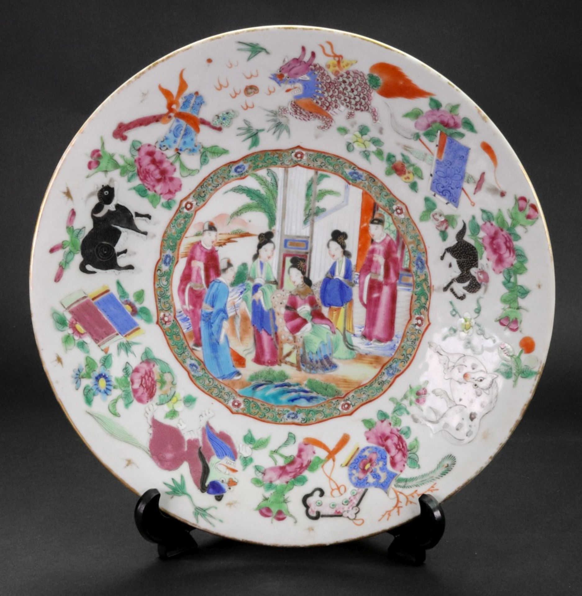 A Canton famille rose dish, mid 19th century, painted with a central figurative panel,