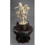 A good and large Japanese ivory okimono of a basket seller, Meiji period,