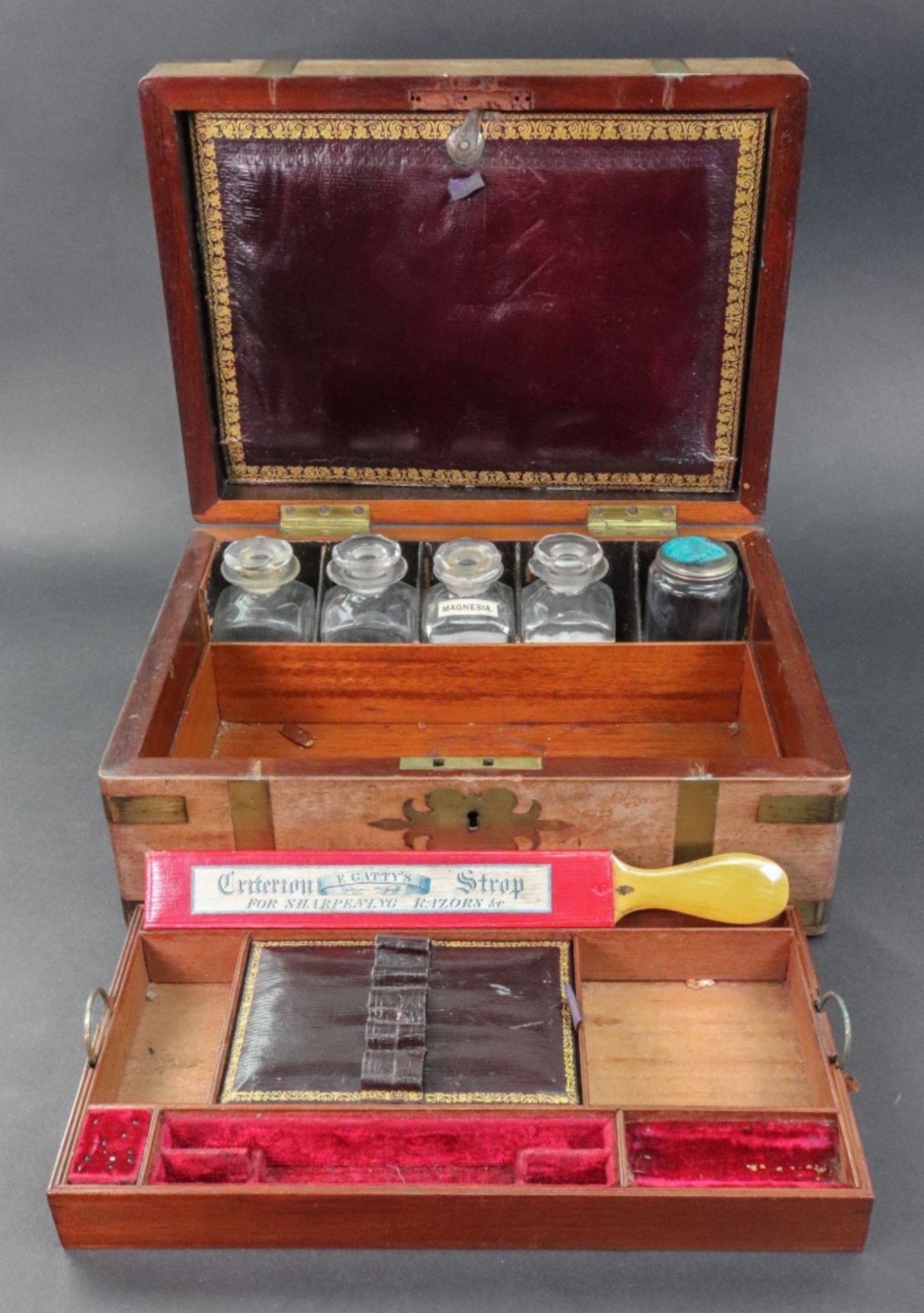 A gentleman's Victorian mahogany brass bound military toilet box,