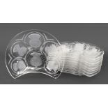 Lalique; a set of nine glass kidney shape salad plates, decorated with thistles,
