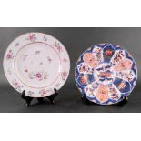 A Chinese Export famille rose plate, Qianlong, painted with scattered flowers, an insect and bird,