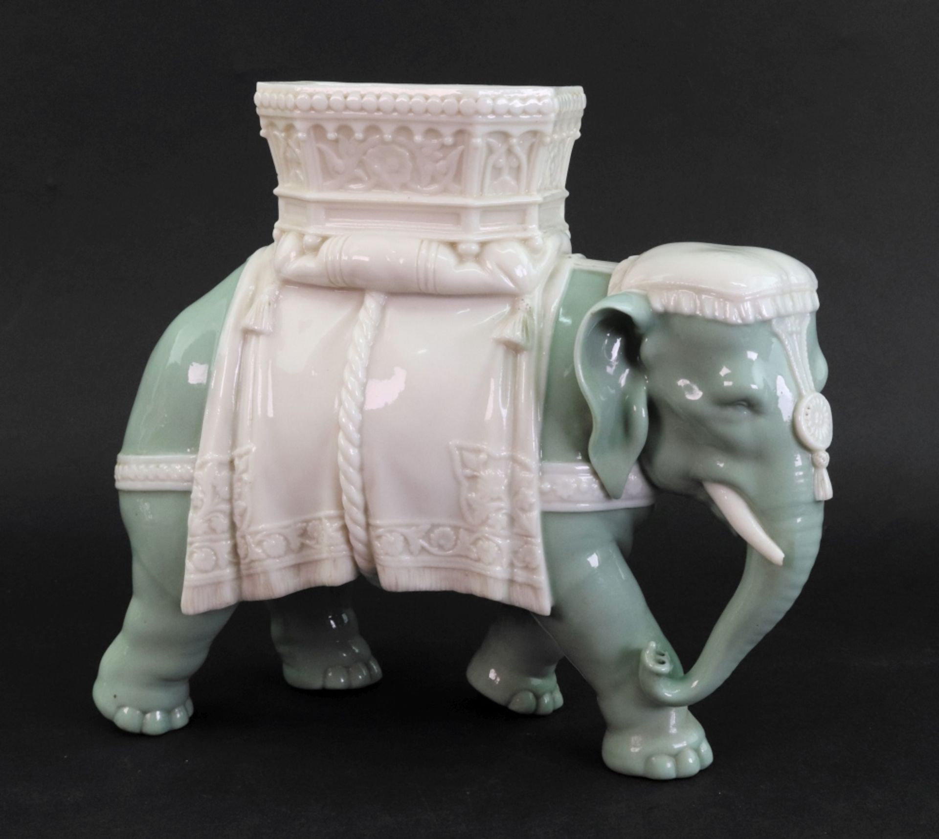 A James Hadley Royal Worcester vase, in the form of an elephant with houdah, 23cm wide x 20cm high.