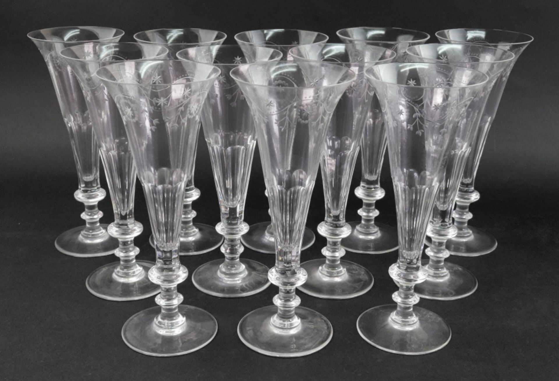 A set of twelve William Yeoward glass champagne flutes,