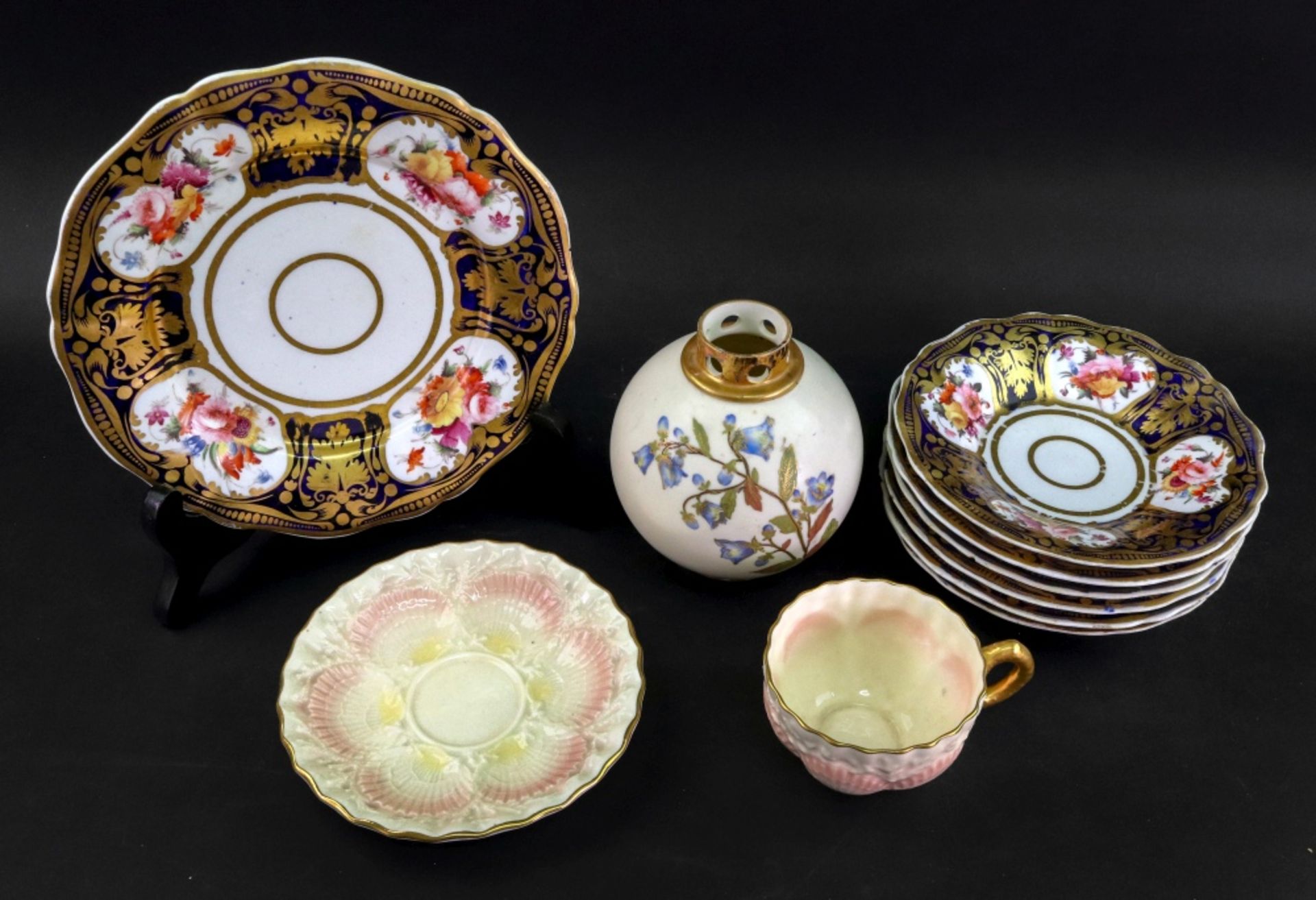 A Royal Worcester ivory ground globular caddy, painted with flowering branches, shape no.