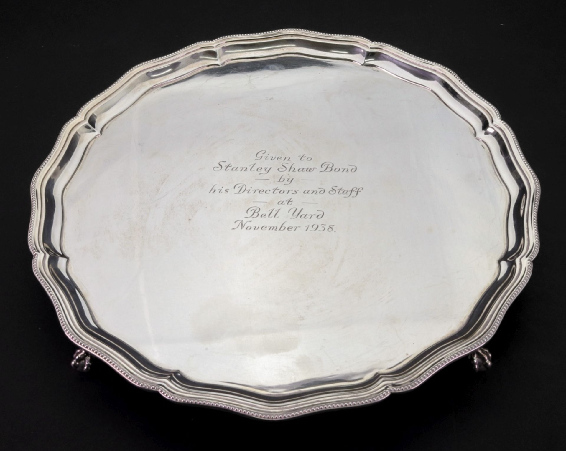 A George III style shaped circular silver salver, Barker Brothers, Birmingham 1938,