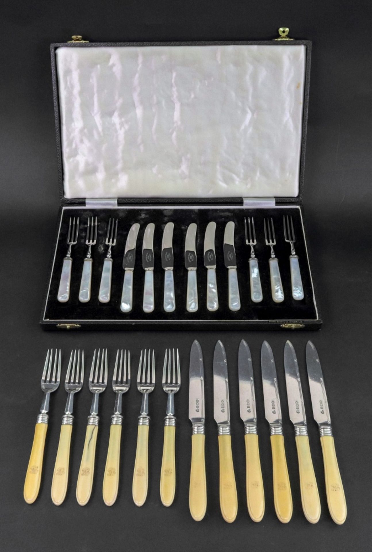 A set of six pairs of silver fruit knives and forks, Goldsmiths & Silversmiths Company,