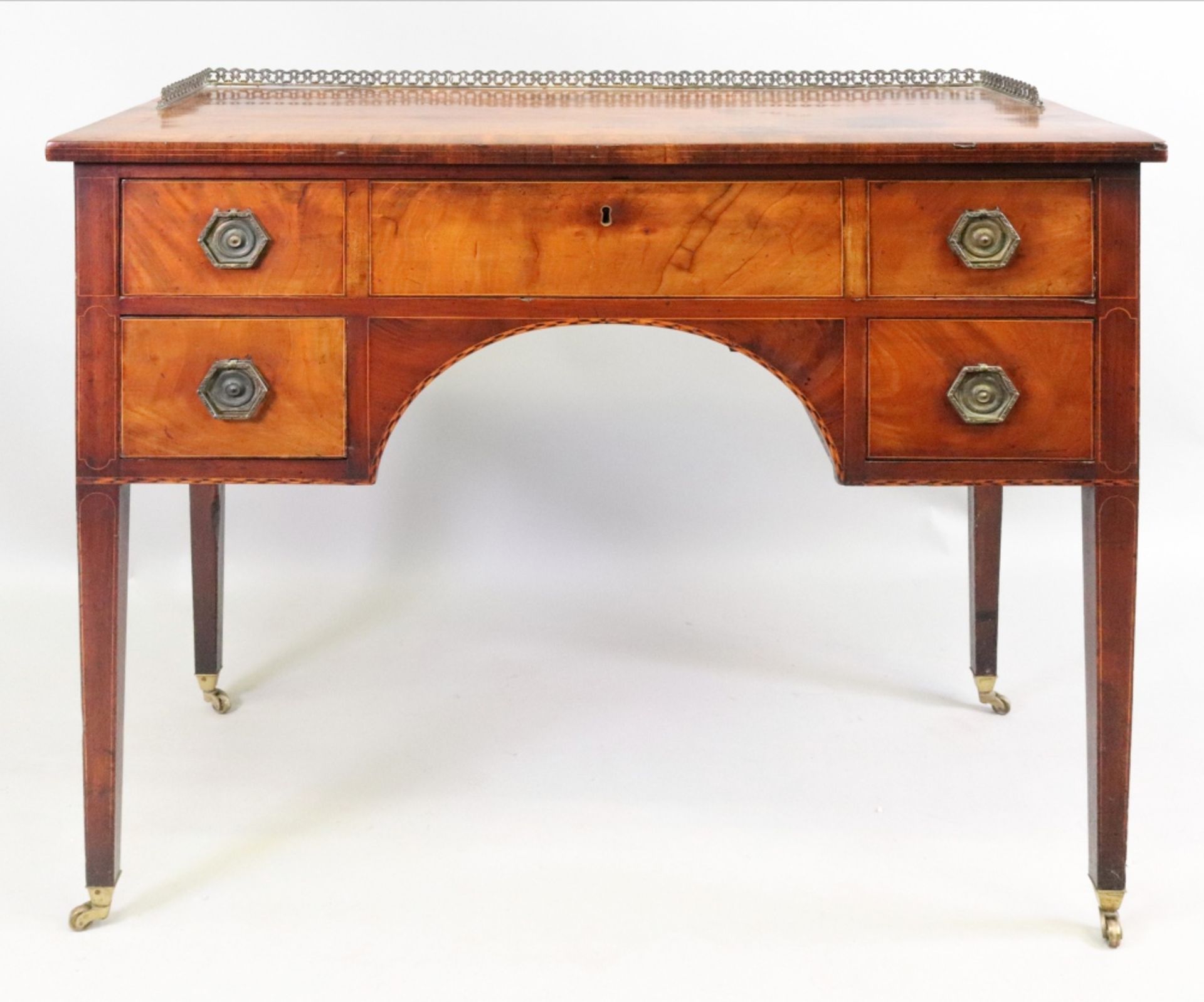 A George III mahogany boxwood and ebony strung dressing table,