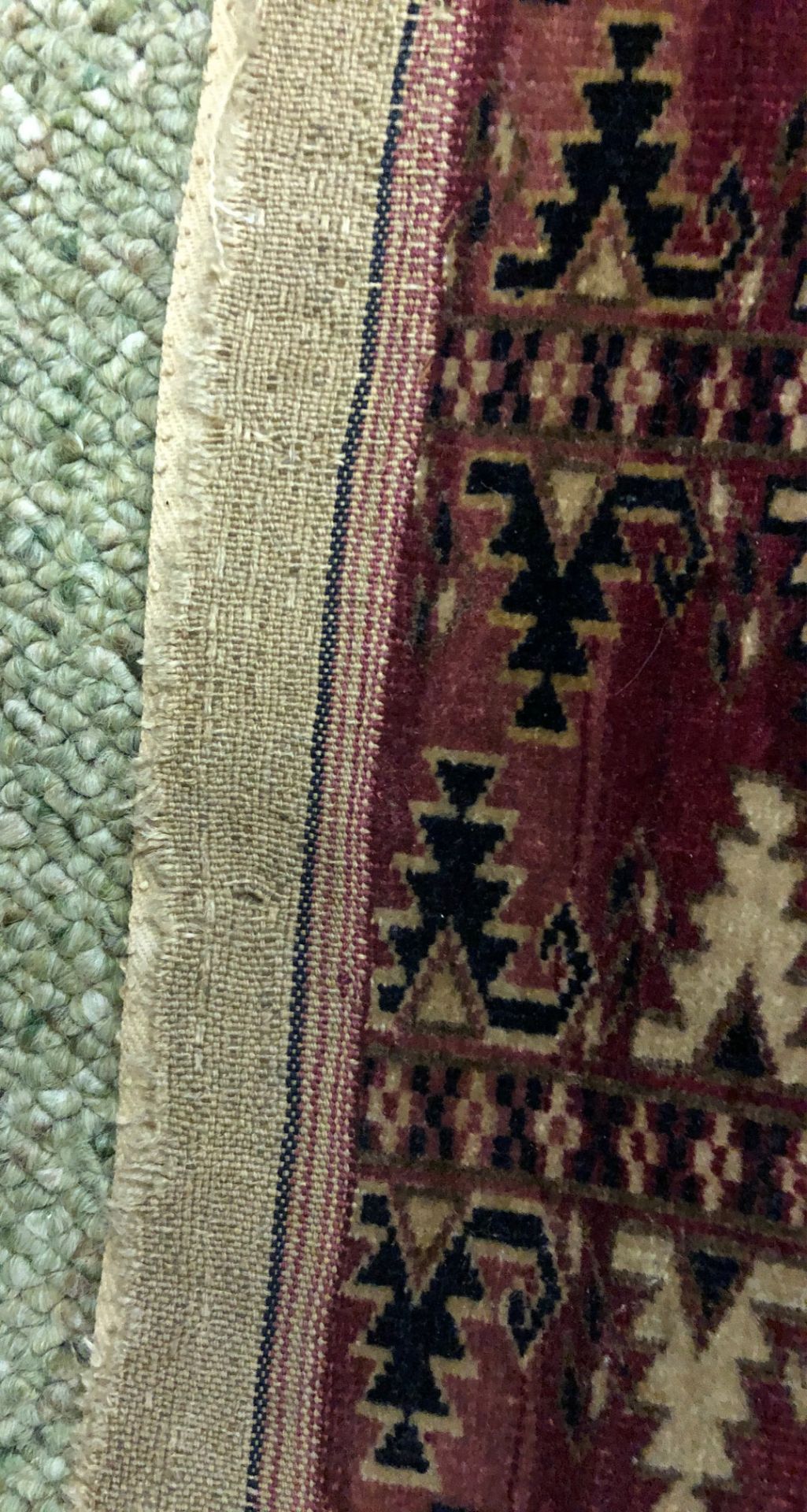 A Yomut Juval rug, with six rows of guls, on a crimson ground, 133 x 67cm. - Image 7 of 7