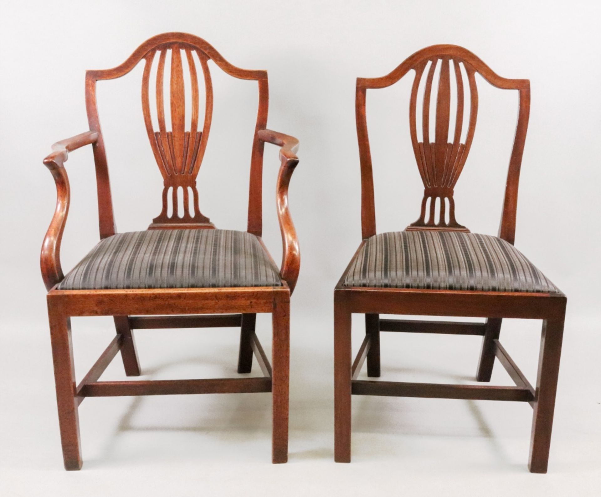 A set of six George III style Hepplewhite design mahogany dining chairs, 19th century,