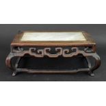 A Chinese rosewood rectangular stand, 19th/early 20th century, the top inset with grey marble,