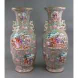 An unusual and large pair of Staffordshire earthenware two handled baluster vases,