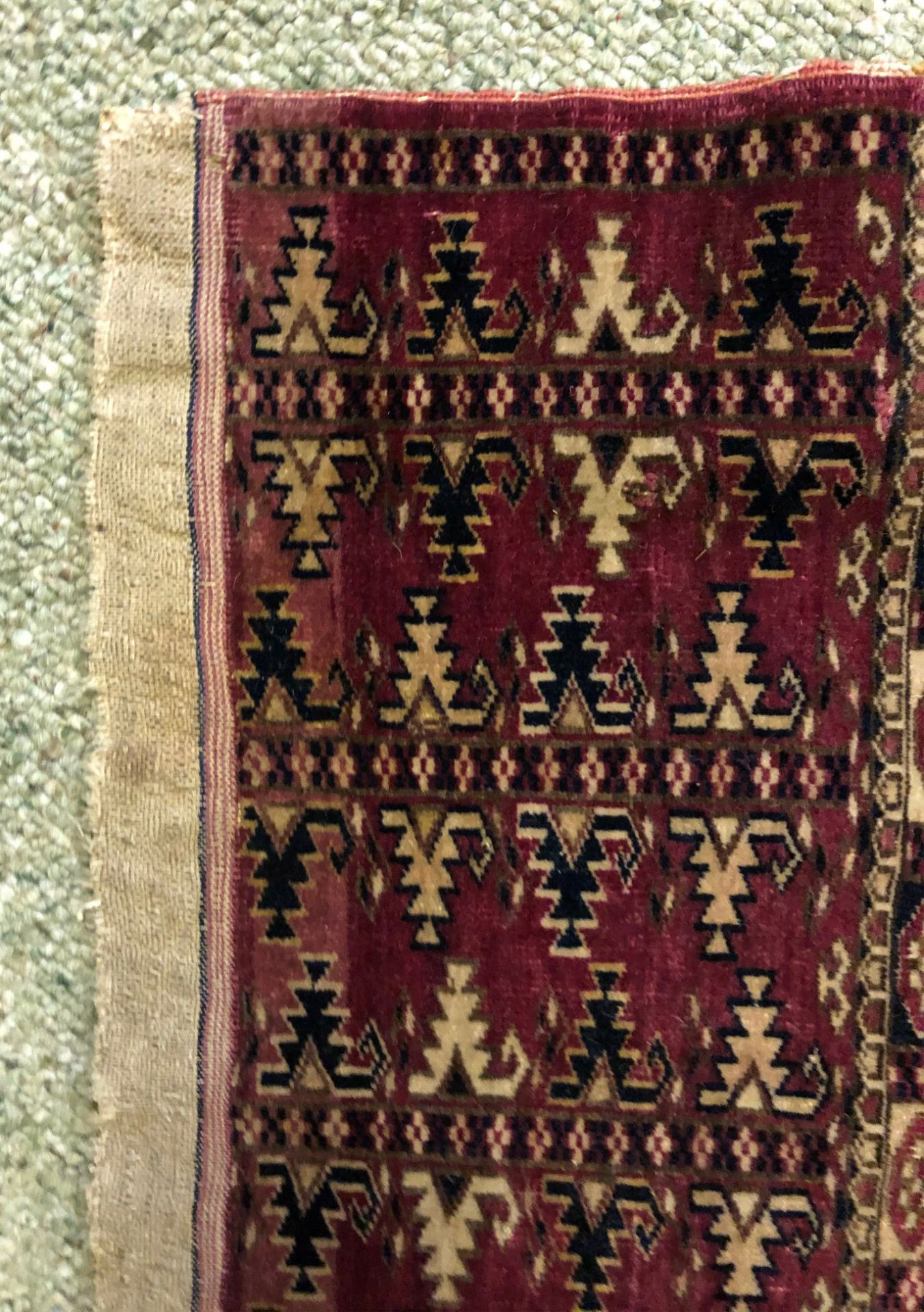 A Yomut Juval rug, with six rows of guls, on a crimson ground, 133 x 67cm. - Image 6 of 7
