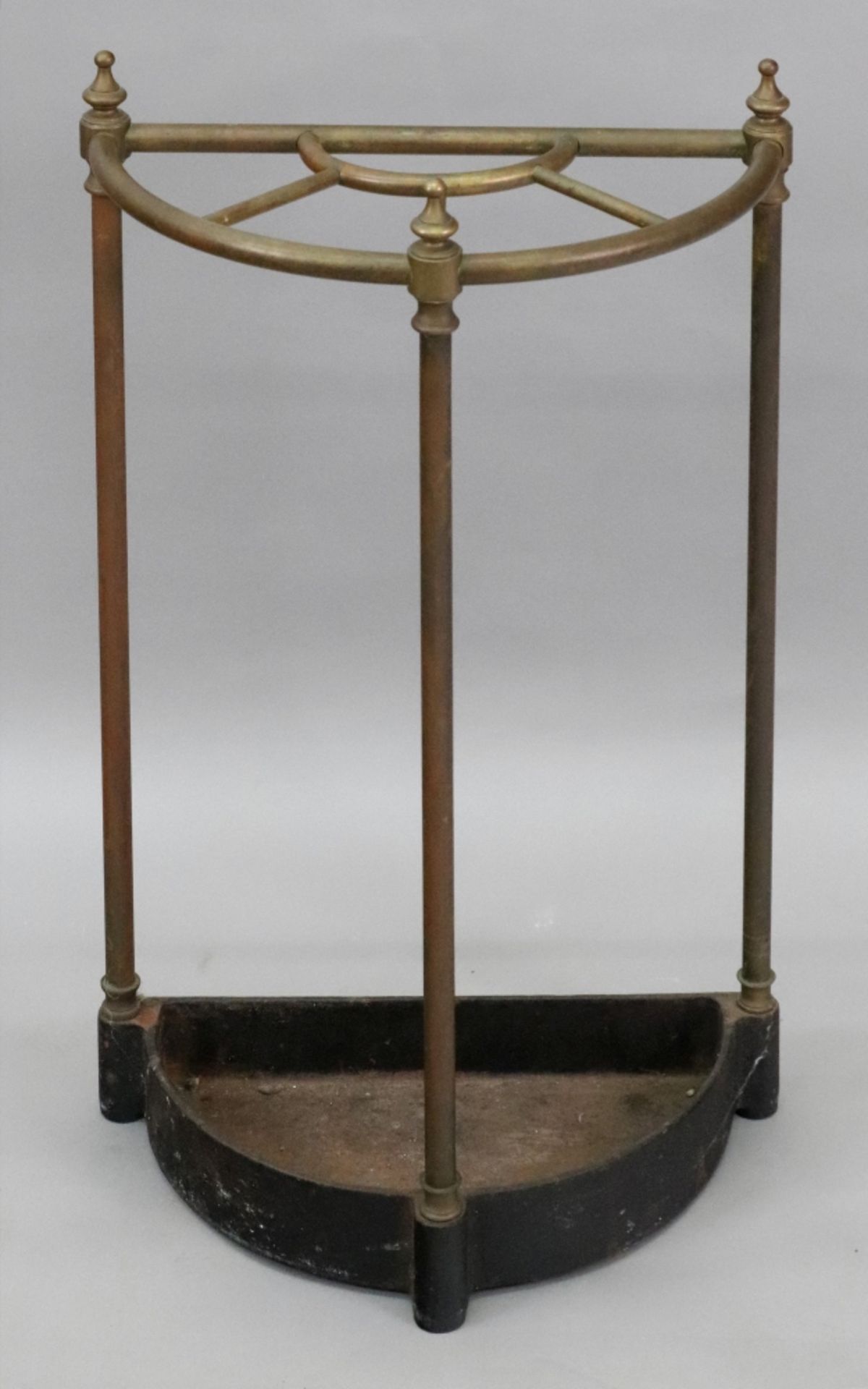 A Victorian style tubular brass column demi-lune stick stand,