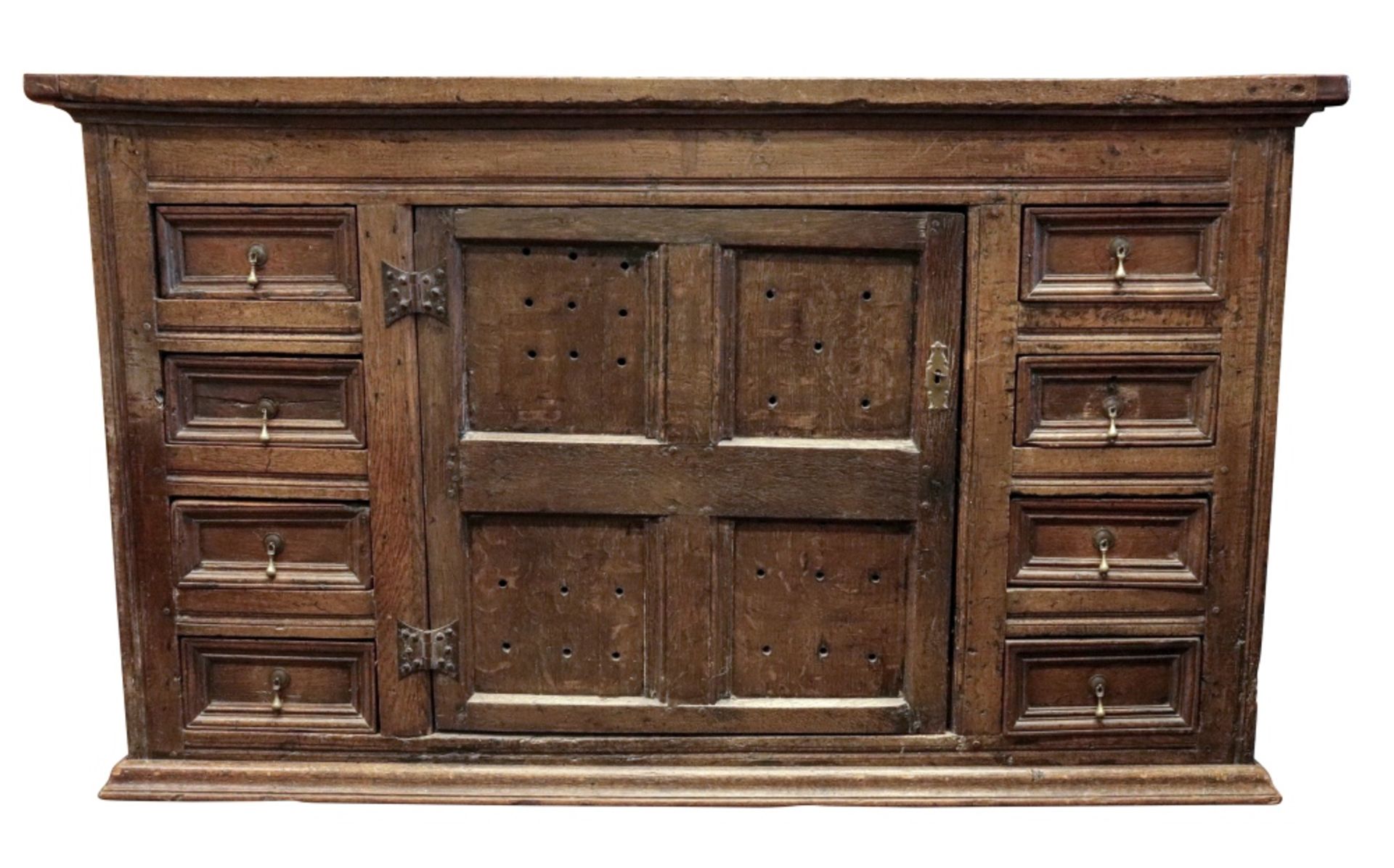 A late 17th century oak food cupboard, altered, of panelled construction,