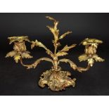 A Louis XV style gilt metal two light dwarf candelabrum, 19th century, cast with acanthus,