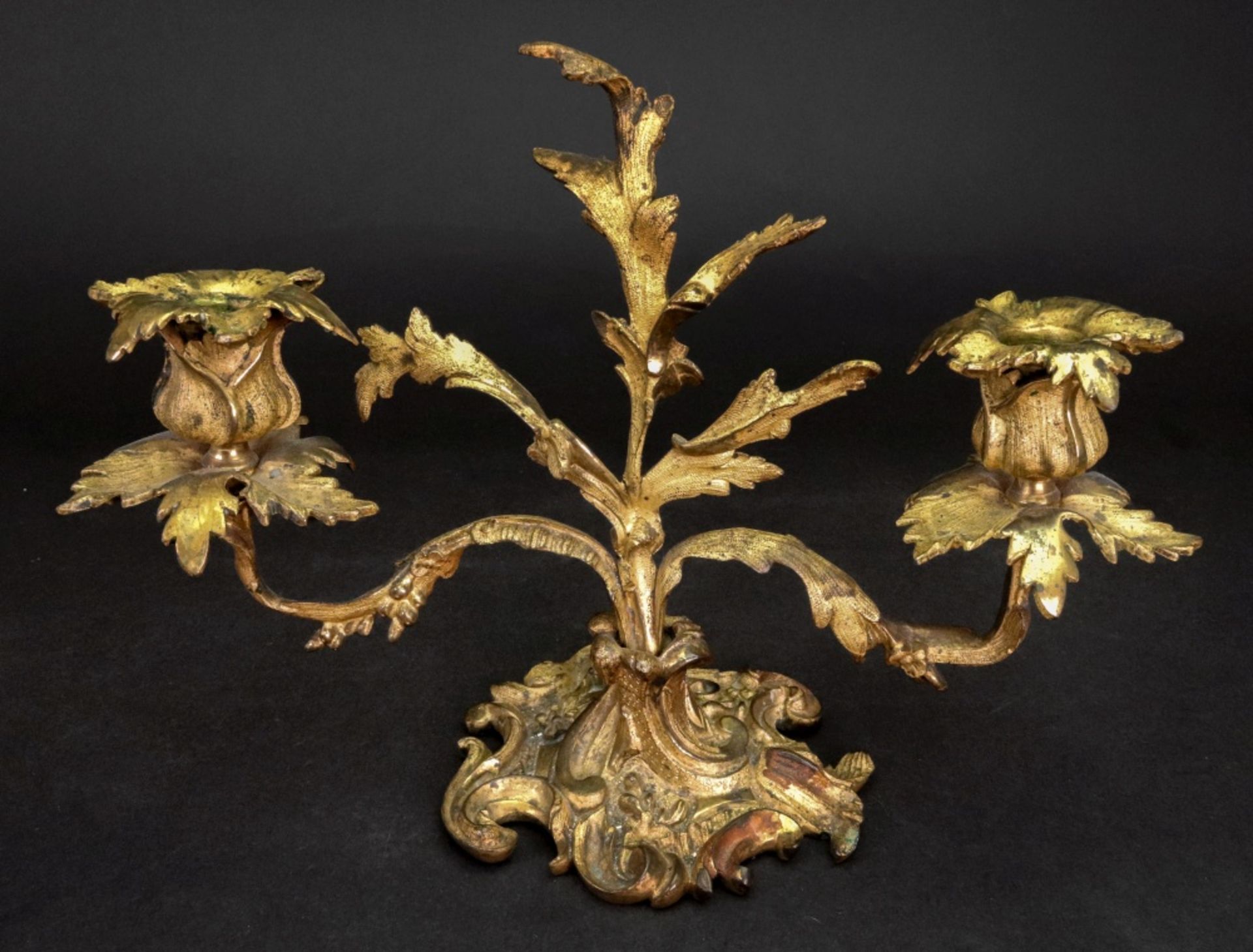 A Louis XV style gilt metal two light dwarf candelabrum, 19th century, cast with acanthus,