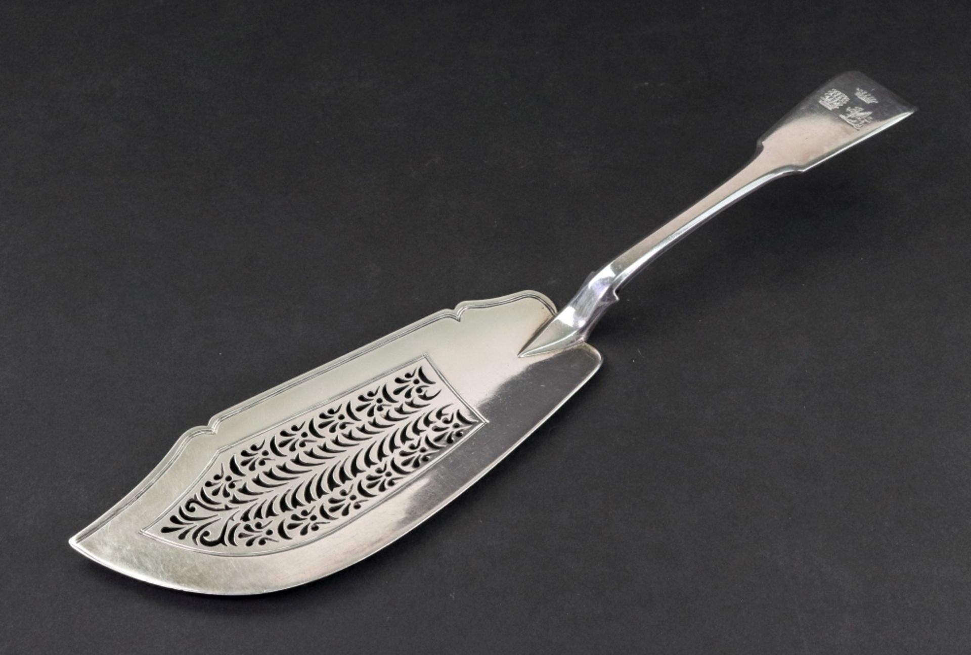 A George IV silver fiddle pattern fish slice, Charles Eley, London 1825, 31cm long, 5.