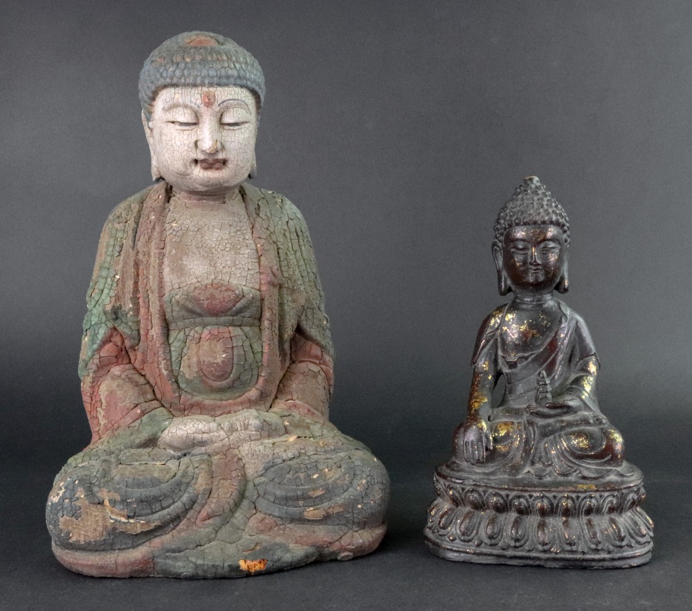 A gilt metal figure of a Buddha,19cm high and a carved wood and painted figure of a seated Buddha,