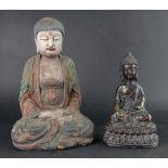 A gilt metal figure of a Buddha,19cm high and a carved wood and painted figure of a seated Buddha,