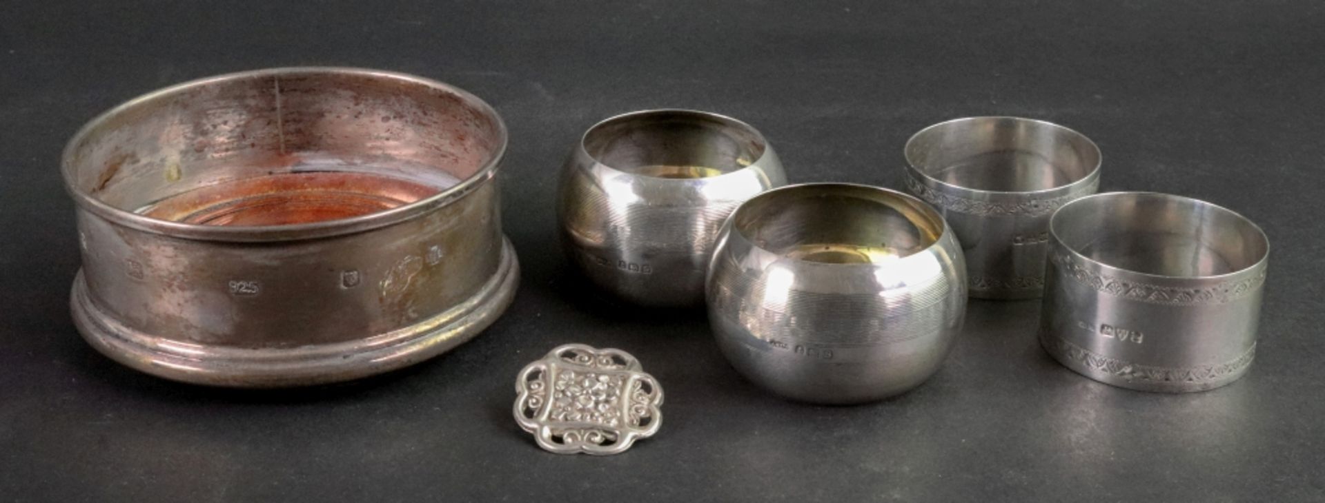 Two pairs of silver napkin rings, one pair, Chester 1922, the others, Birmingham 1942,