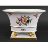A Herend oval tapering vase, in the form of a Roman cistern, painted with fruits and flowers,