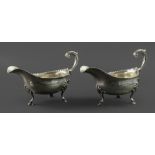 A pair of George III helmet shape silver sauce boats, Charles Hougham, London 1786,