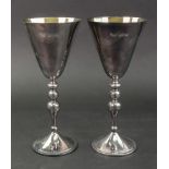 A pair of 17th century style silver goblets, Asprey, London 1997, with gilt lined conical bowls,
