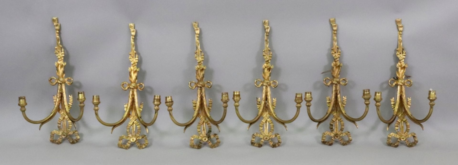 A set of six gilt metal twin branch wall applique, in Regency style,