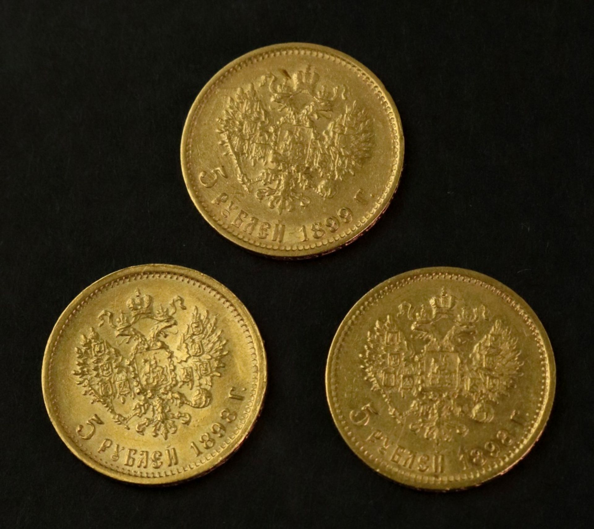 A Russian five ruble coin, 1898, together with two others, 1898 and 1899, 12.8g combined, (3). - Image 2 of 3