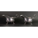 A pair of George II style helmet shape silver sauce boats, Walker & Hall, Chester 1906,