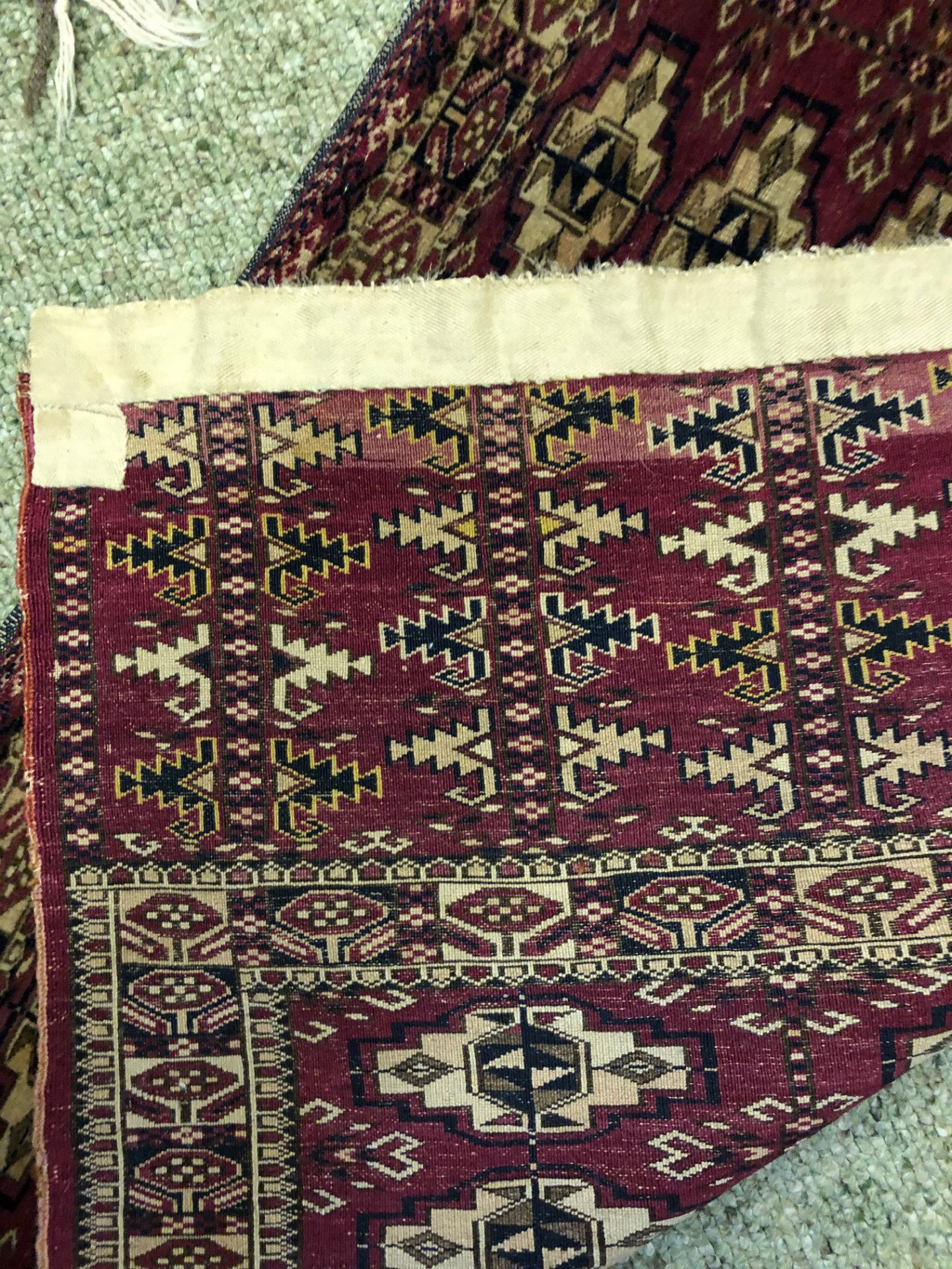 A Yomut Juval rug, with six rows of guls, on a crimson ground, 133 x 67cm. - Image 3 of 7