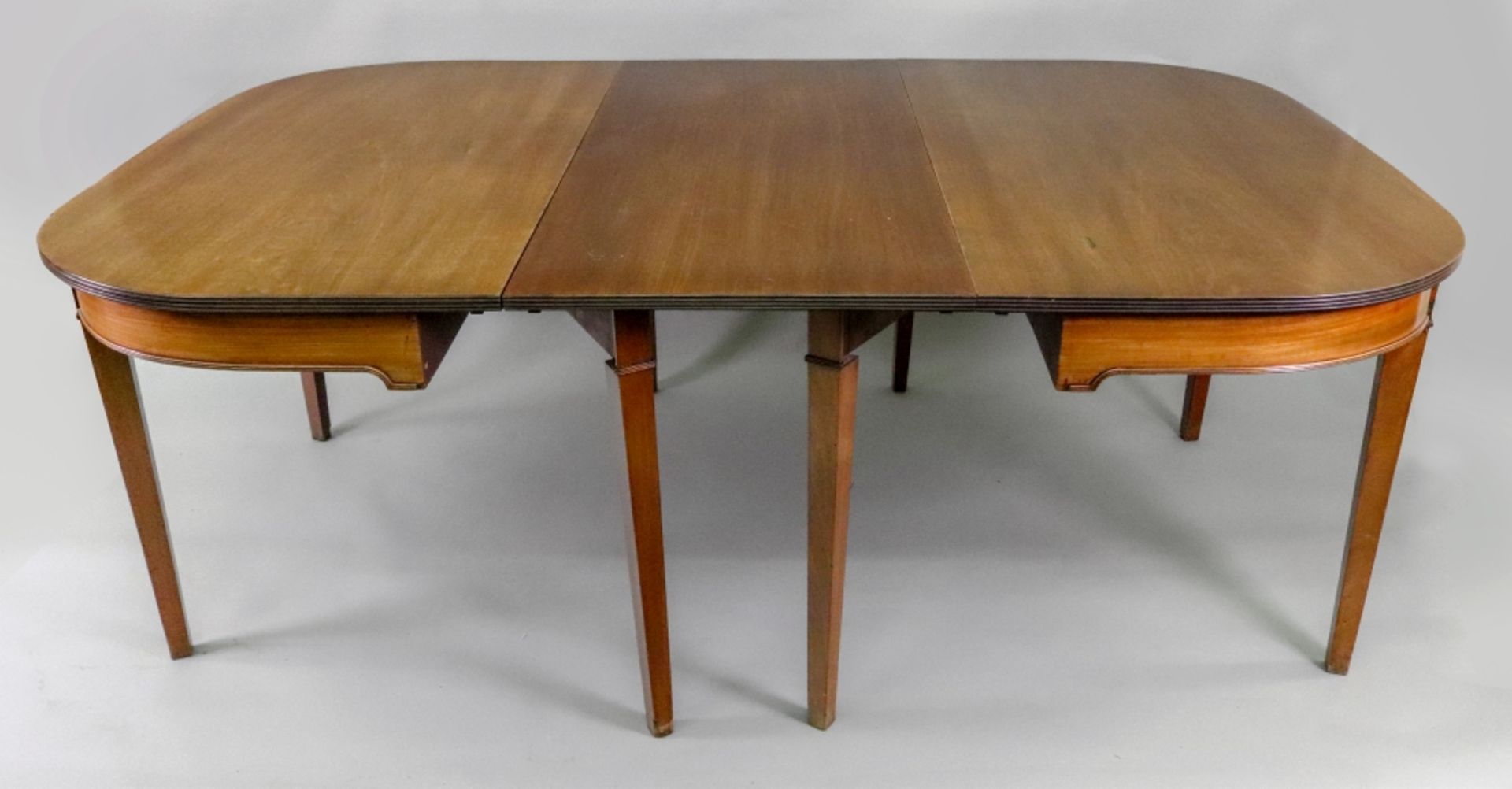 A George III mahogany dining table,