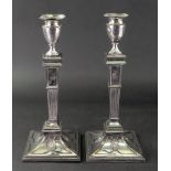 A pair of Old Sheffield plate candlesticks, with vase shape sconces,