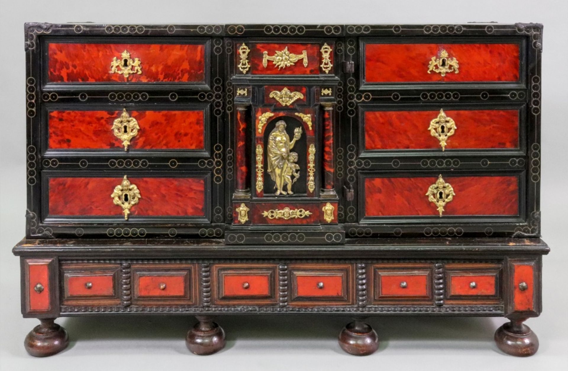 A late 17th century Flemish ebony cedar and tortoiseshell veneered table cabinet,