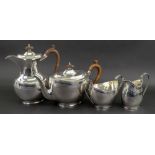 A George III style four piece oval silver tea service, Goldsmiths & Silversmiths Company,