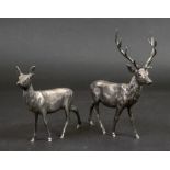 A pair of modern cast silver figures of a stag and deer, with cabochon set eyes, London 2001,