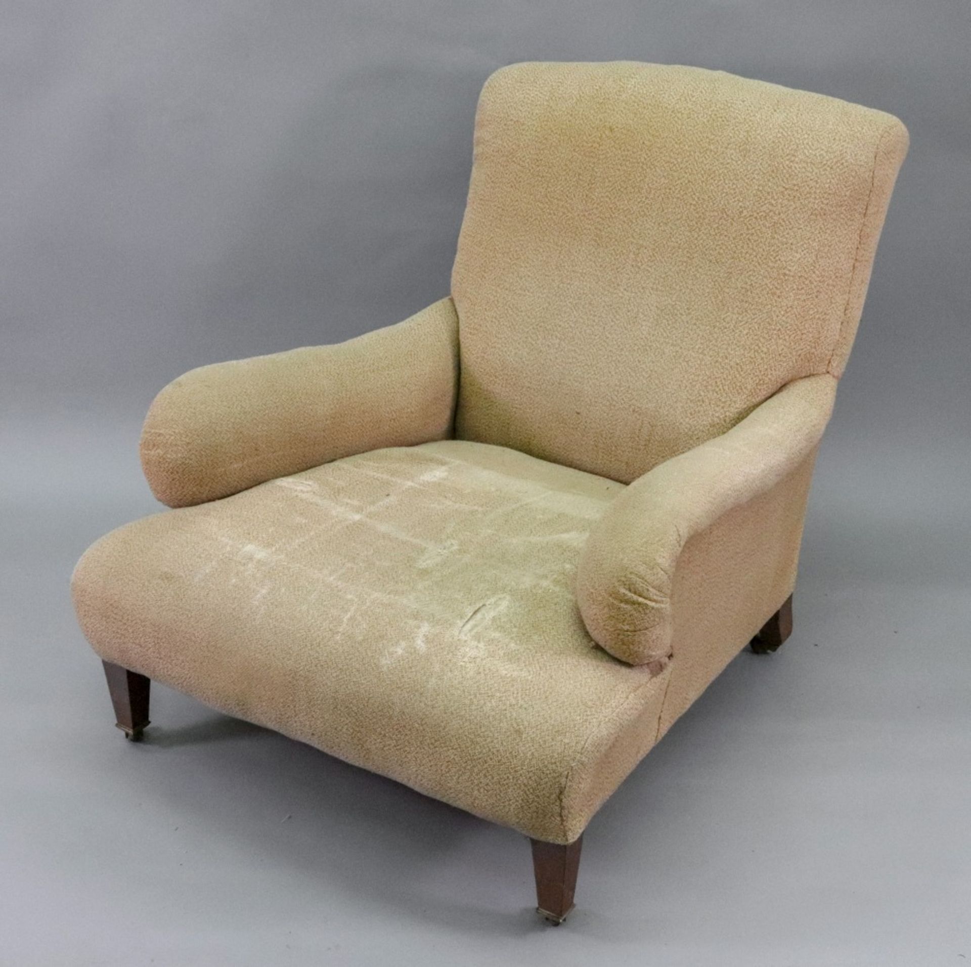 Howard & Sons; an upholstered deep seated armchair, on square tapered legs and brass castors, - Image 3 of 7