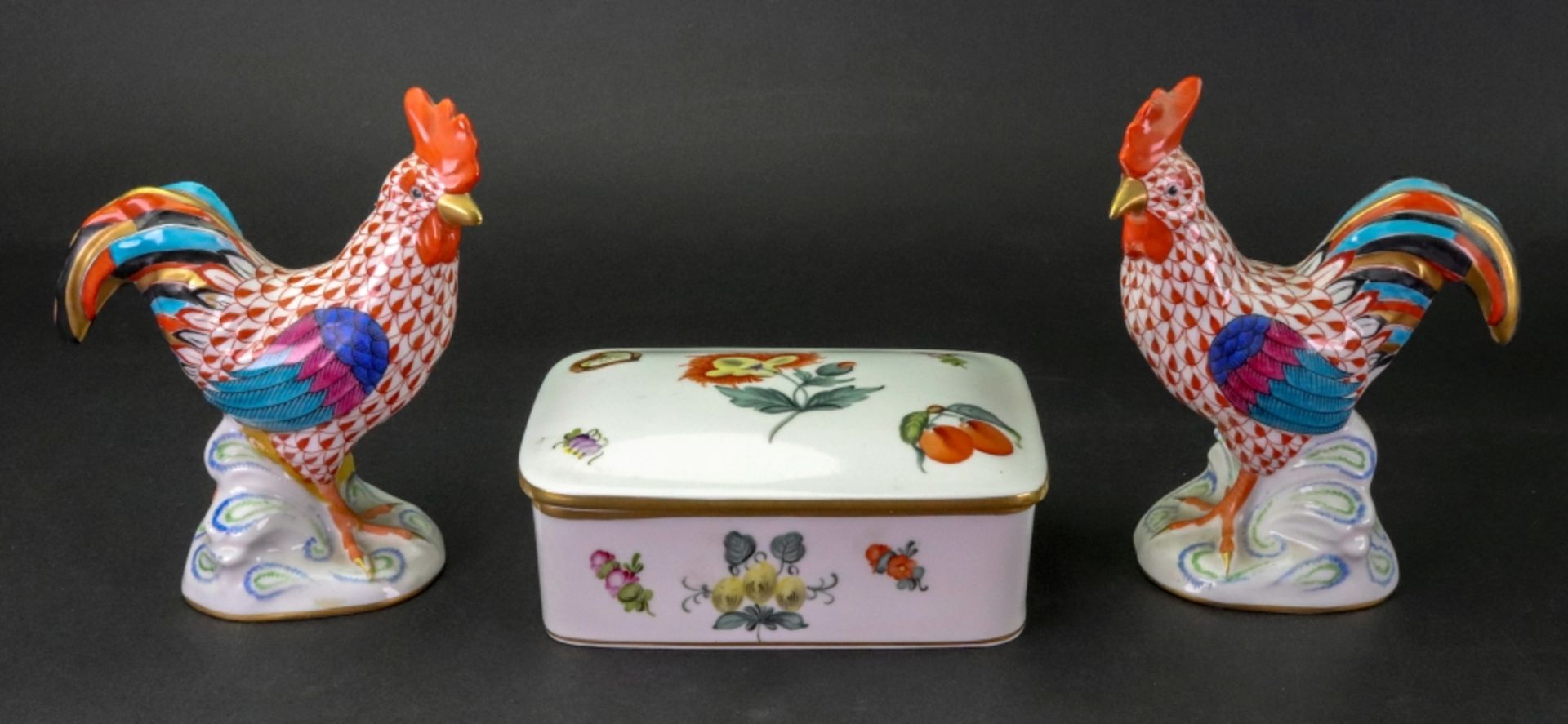 A Herend rectangular box and cover, painted with flowers and fruits,