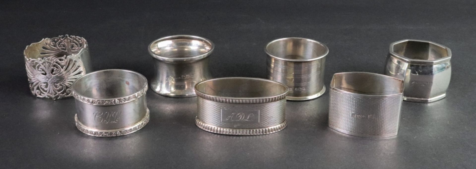 A group of seven silver napkin rings, mostly inscribed, 6.1ozs (7).