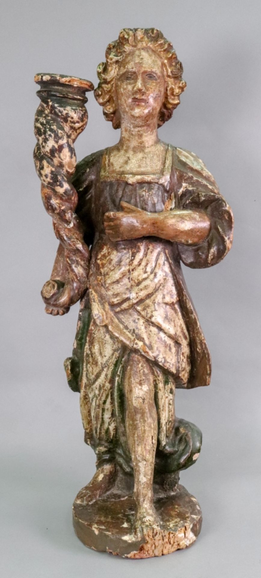 An Italian carved pine polychrome painted candlestick, 17th century,