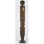 An African tribal totem pole on an ebonised square plinth, 170cm high.