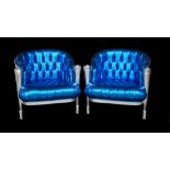 A pair of silver painted tub chairs with button back faux electric blue lizard skin upholstery on