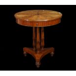A pair of Regency style mahogany circular centre tables with four drawers on trefoil base,