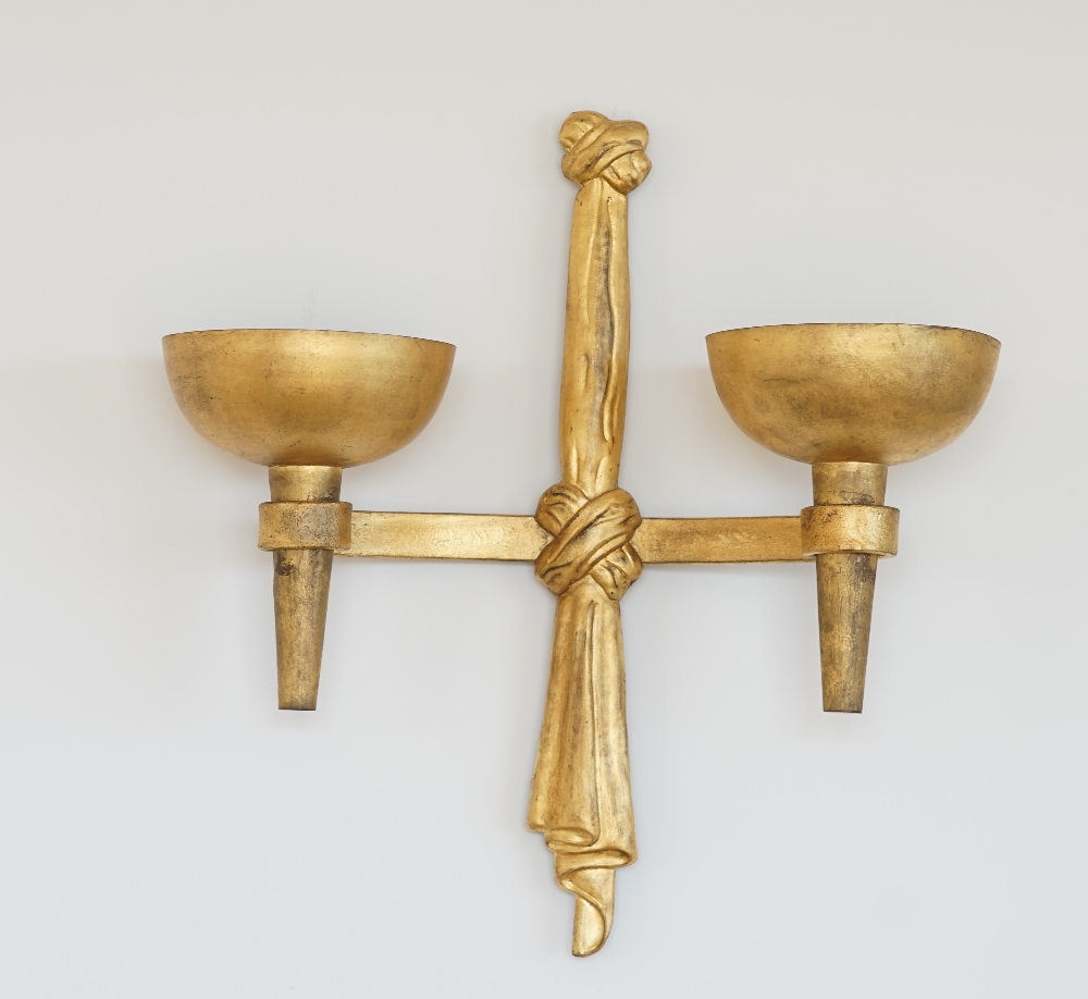 A pair of modern twin branch gilt metal wall lights with ribbon decoration, 60cm high x 64cm wide.